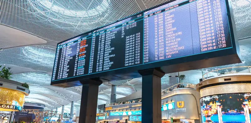 Large digital information display screens in a busy terminal