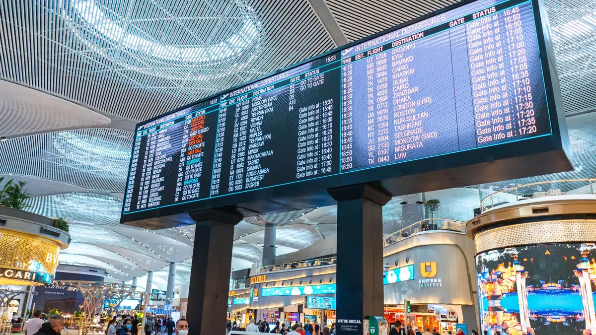 Large digital information display screens in a busy terminal